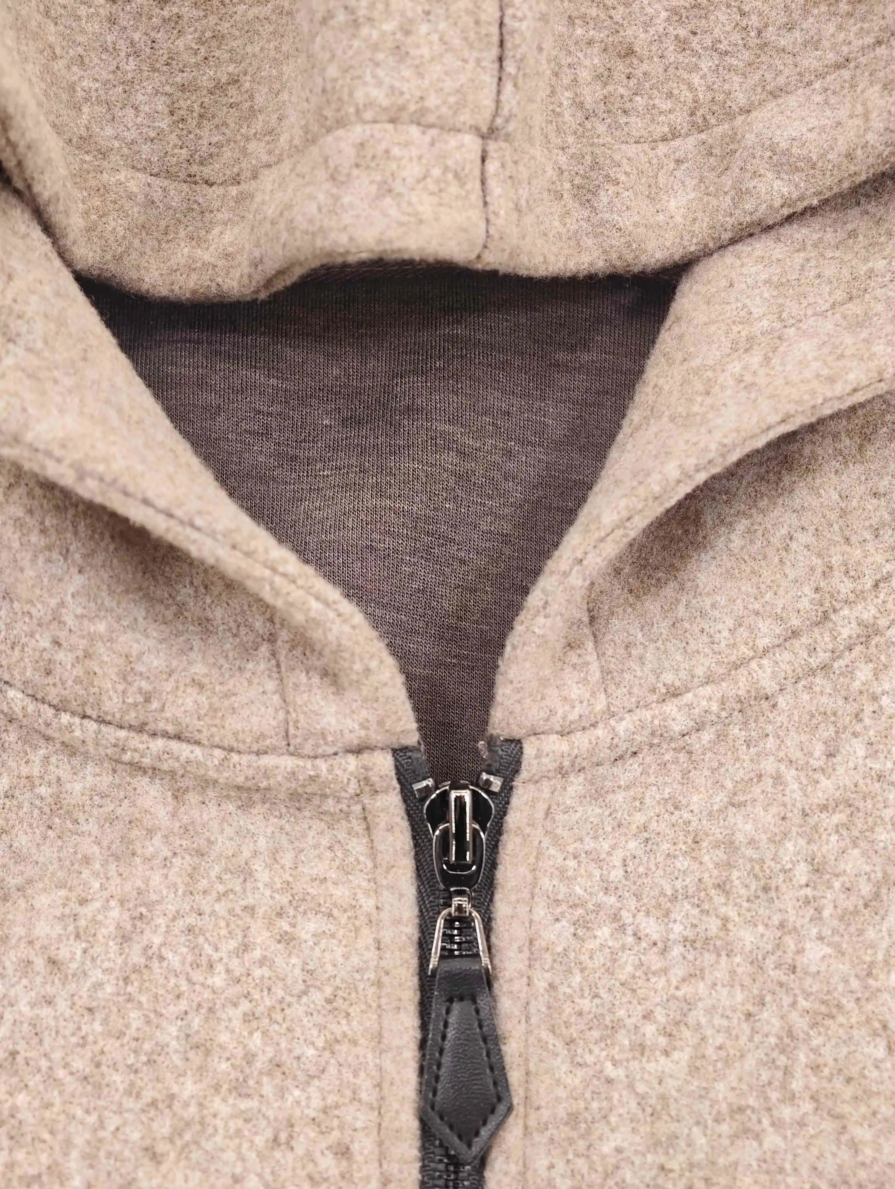 Hood neckline and metal zipper pull construction close-up