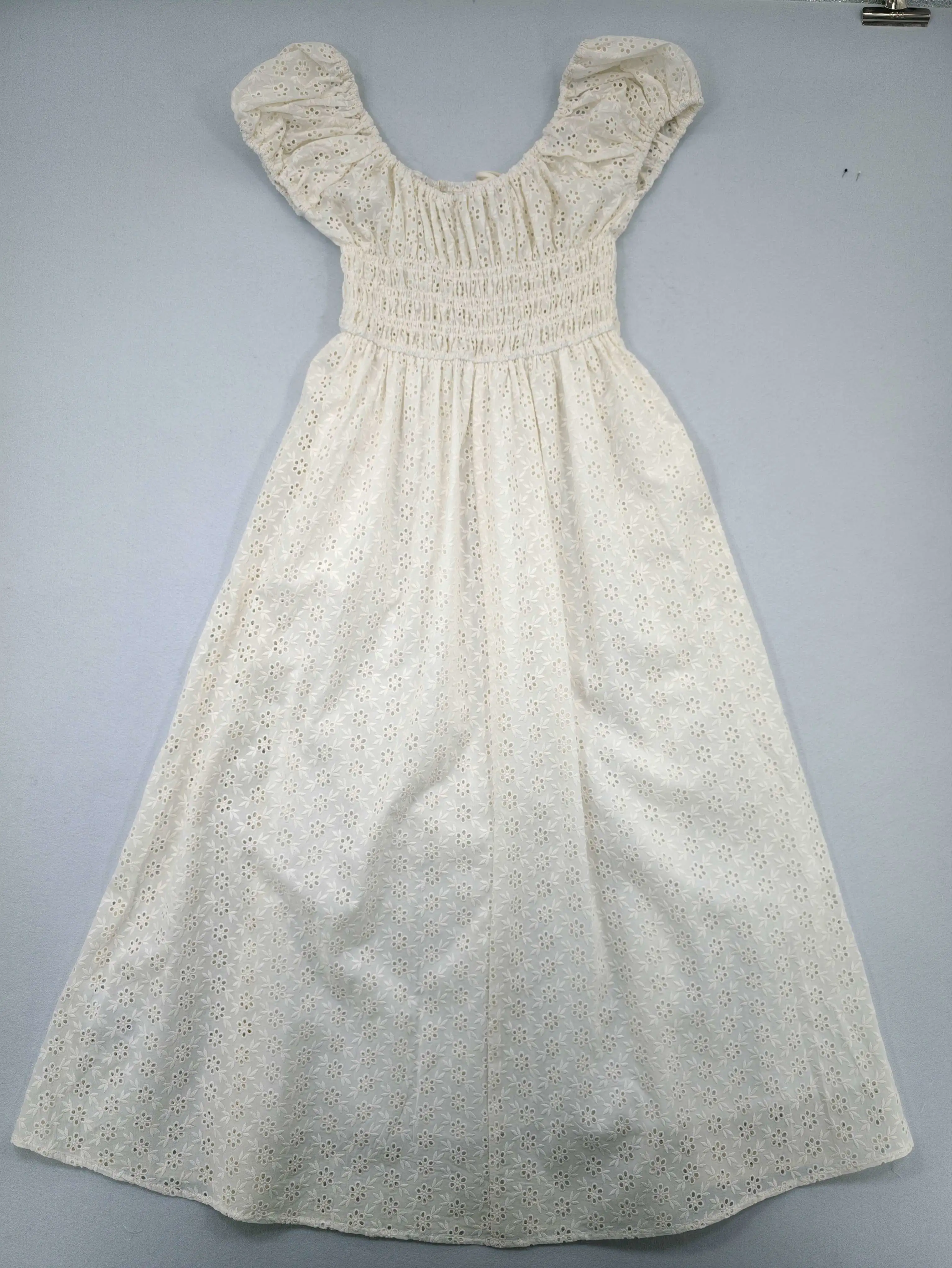 Back view with smocked waist and full skirt