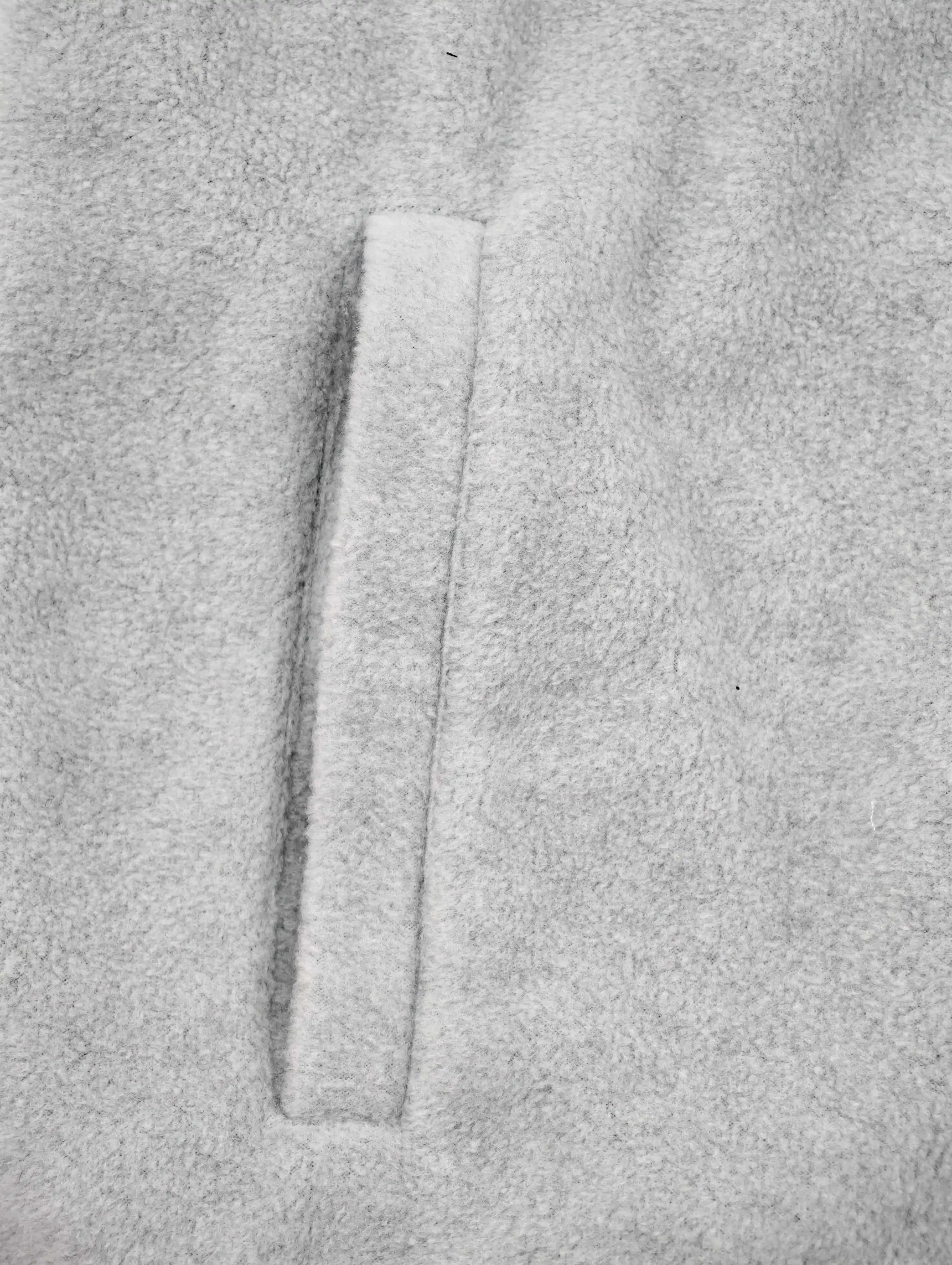 Vertical side pocket opening on soft fleece fabric
