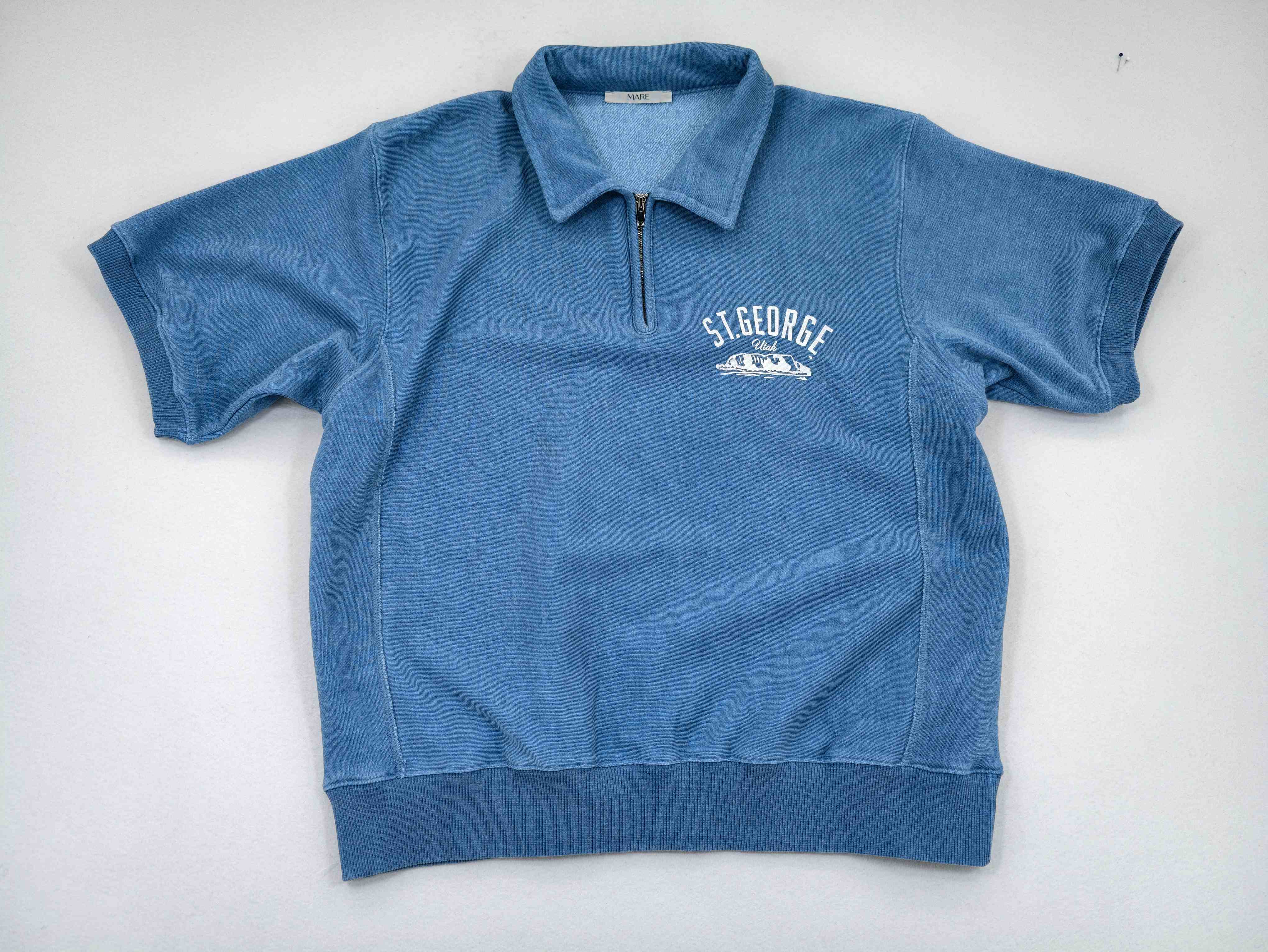 Washed blue French terry half-zip polo front view