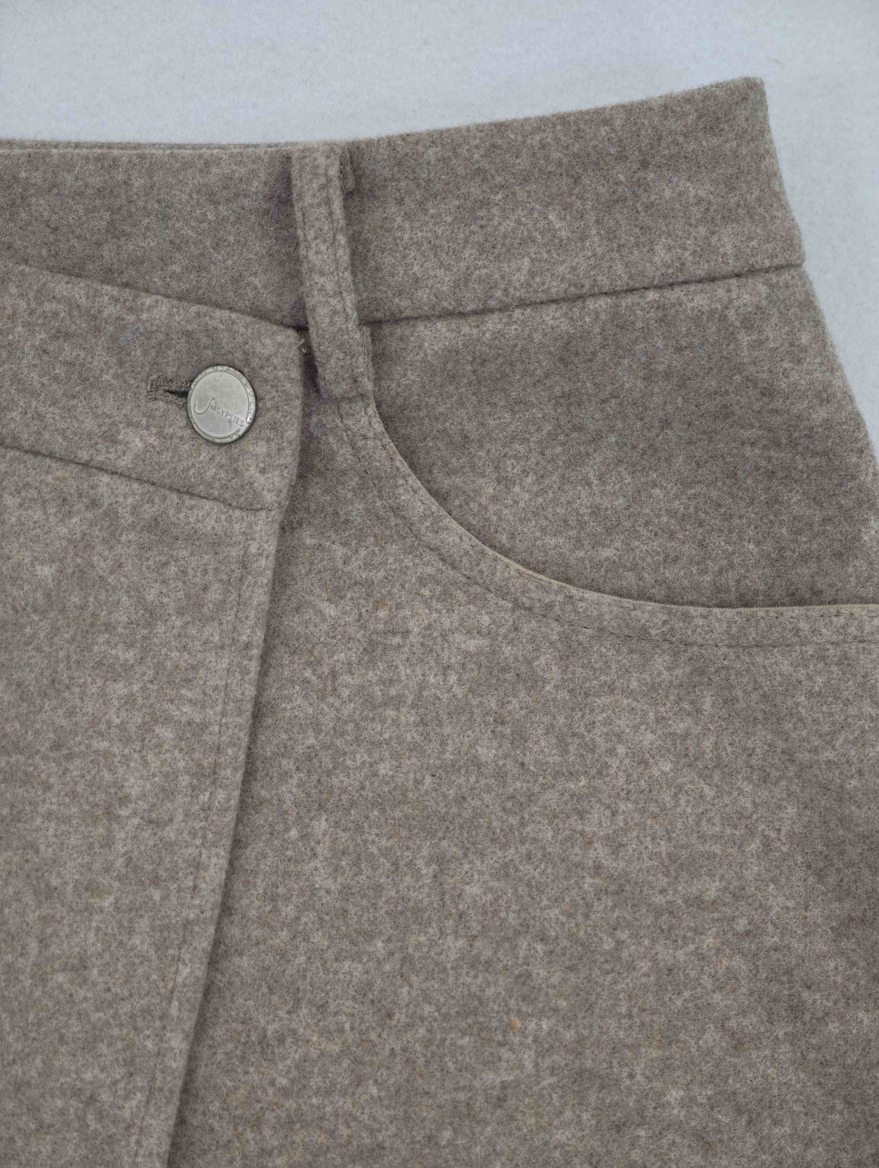 Wrap waistband and curved pocket construction detail