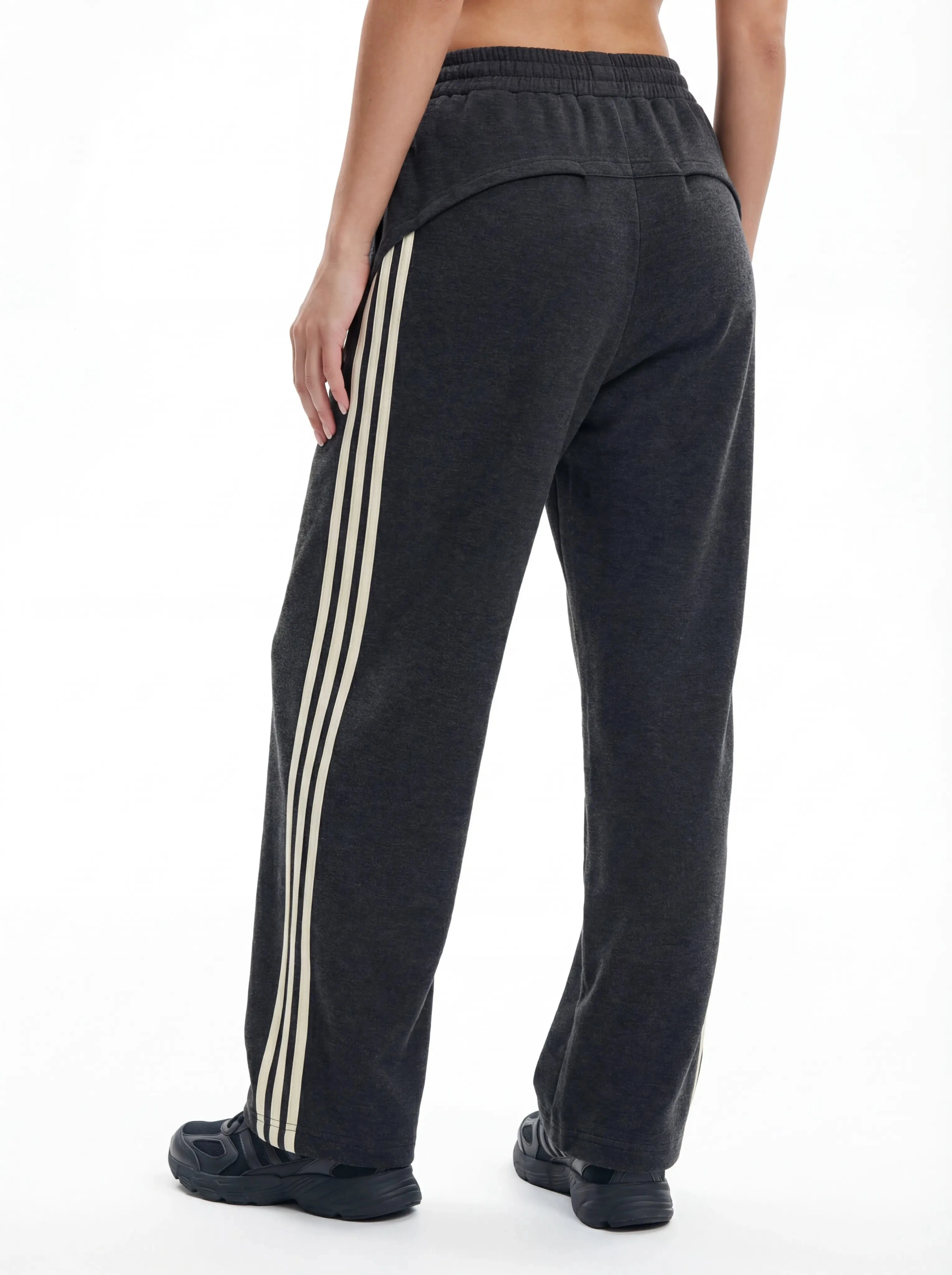 Three-quarter back view of custom striped track pants
