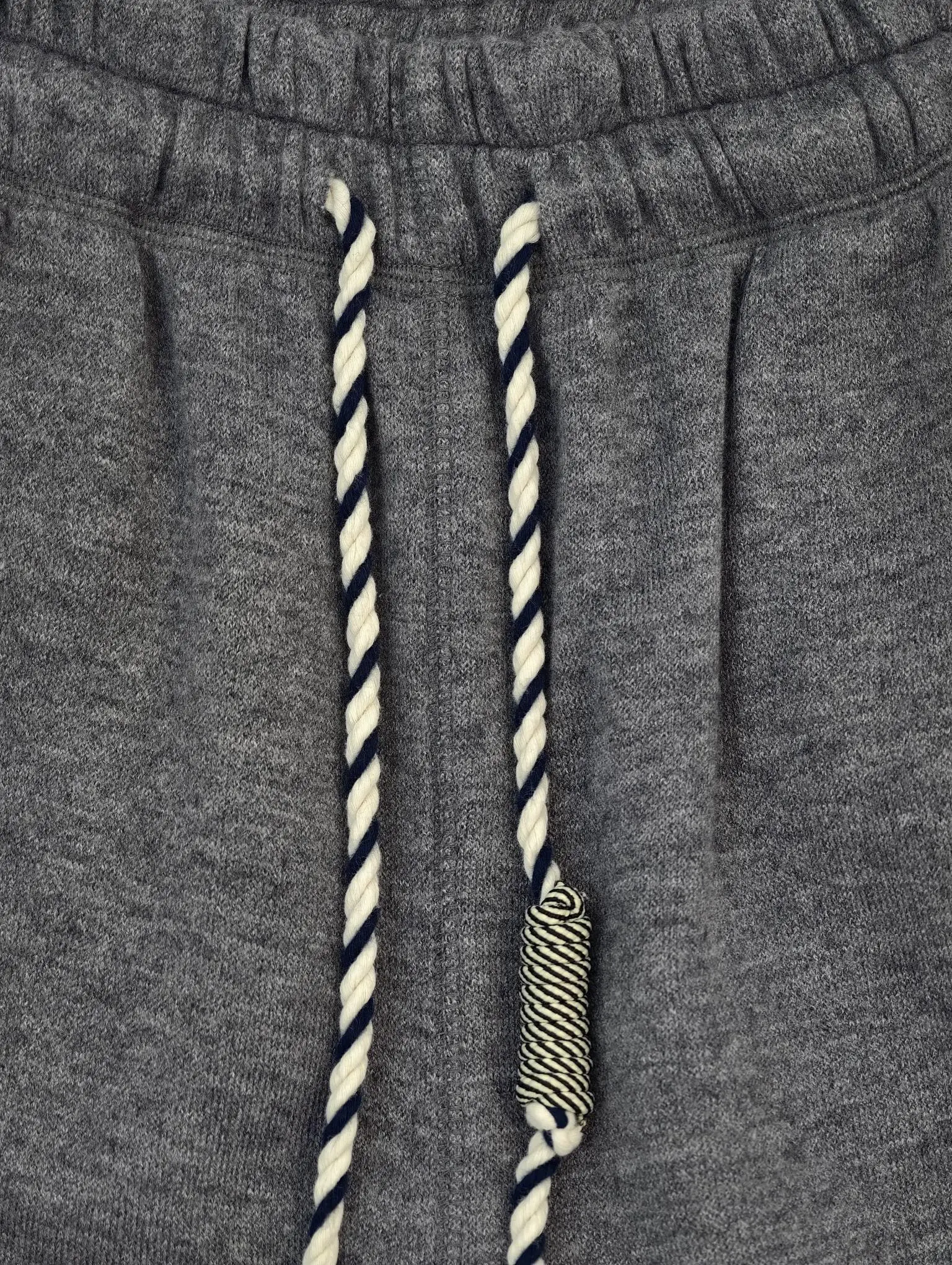 Twisted drawcord and elastic waistband construction detail
