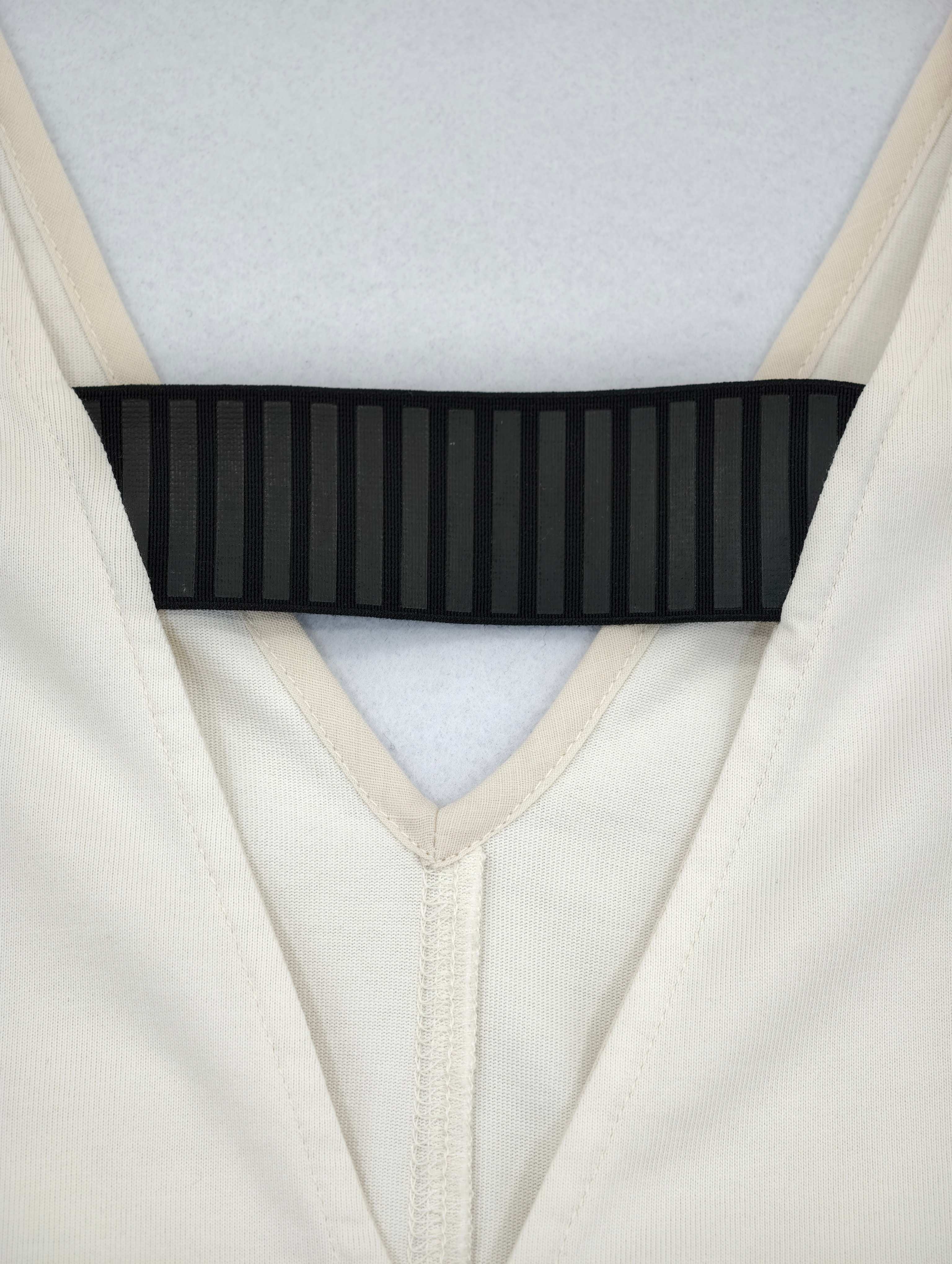 Black ribbed chest strap across bound V neckline