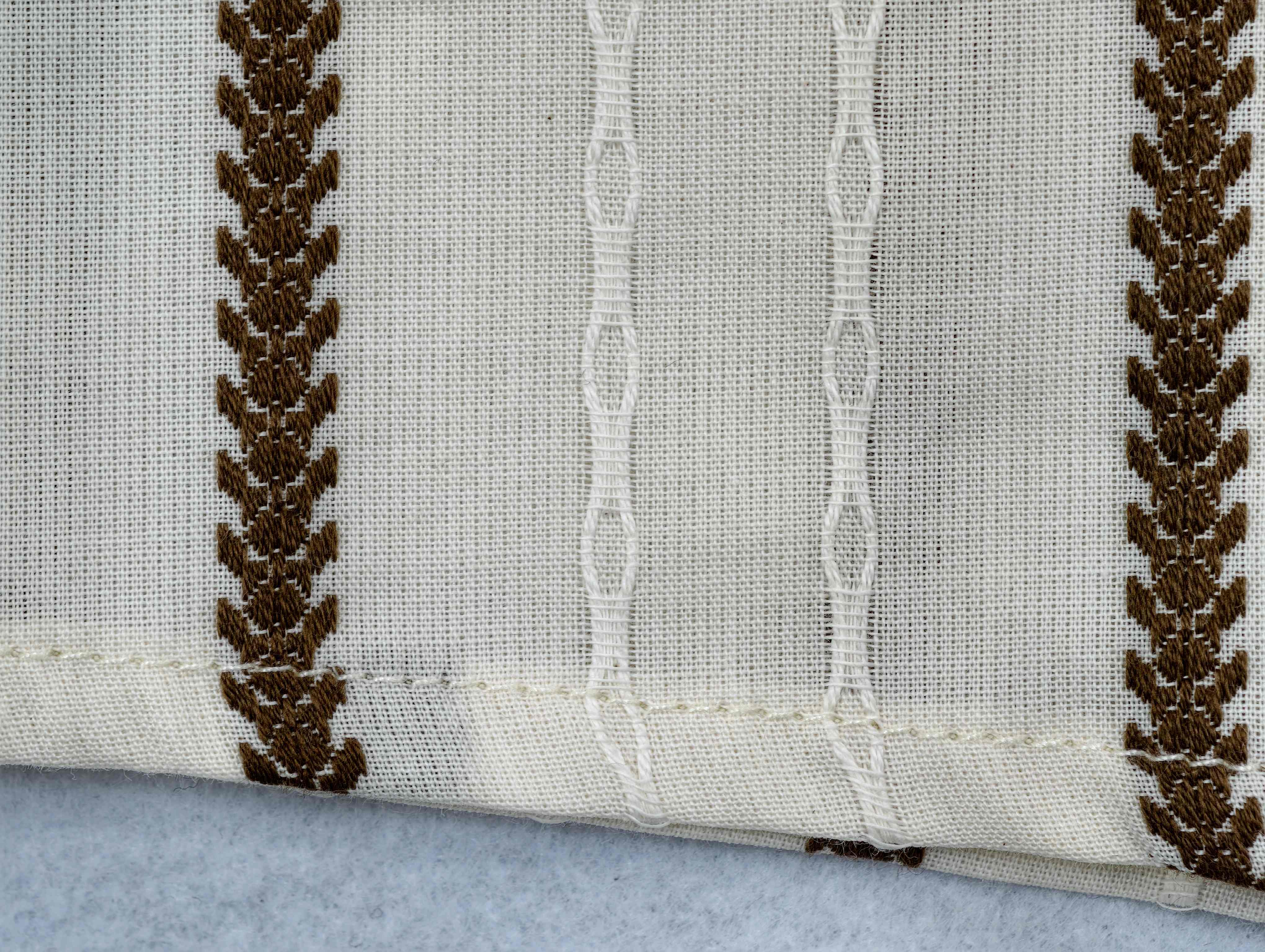 Woven stripe texture and hem stitching close-up