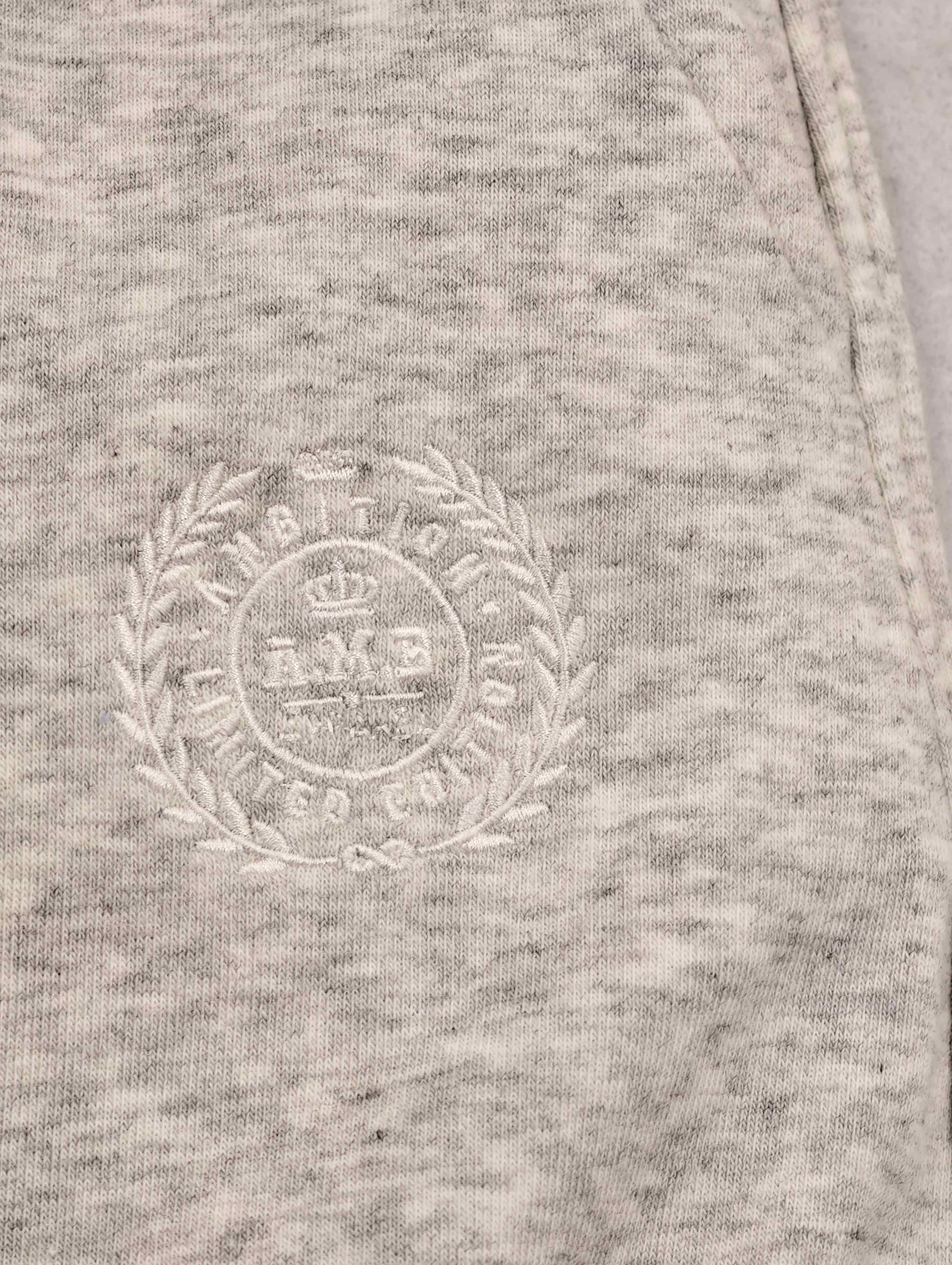 Tonal crest embroidery on cotton-modal skirt fabric