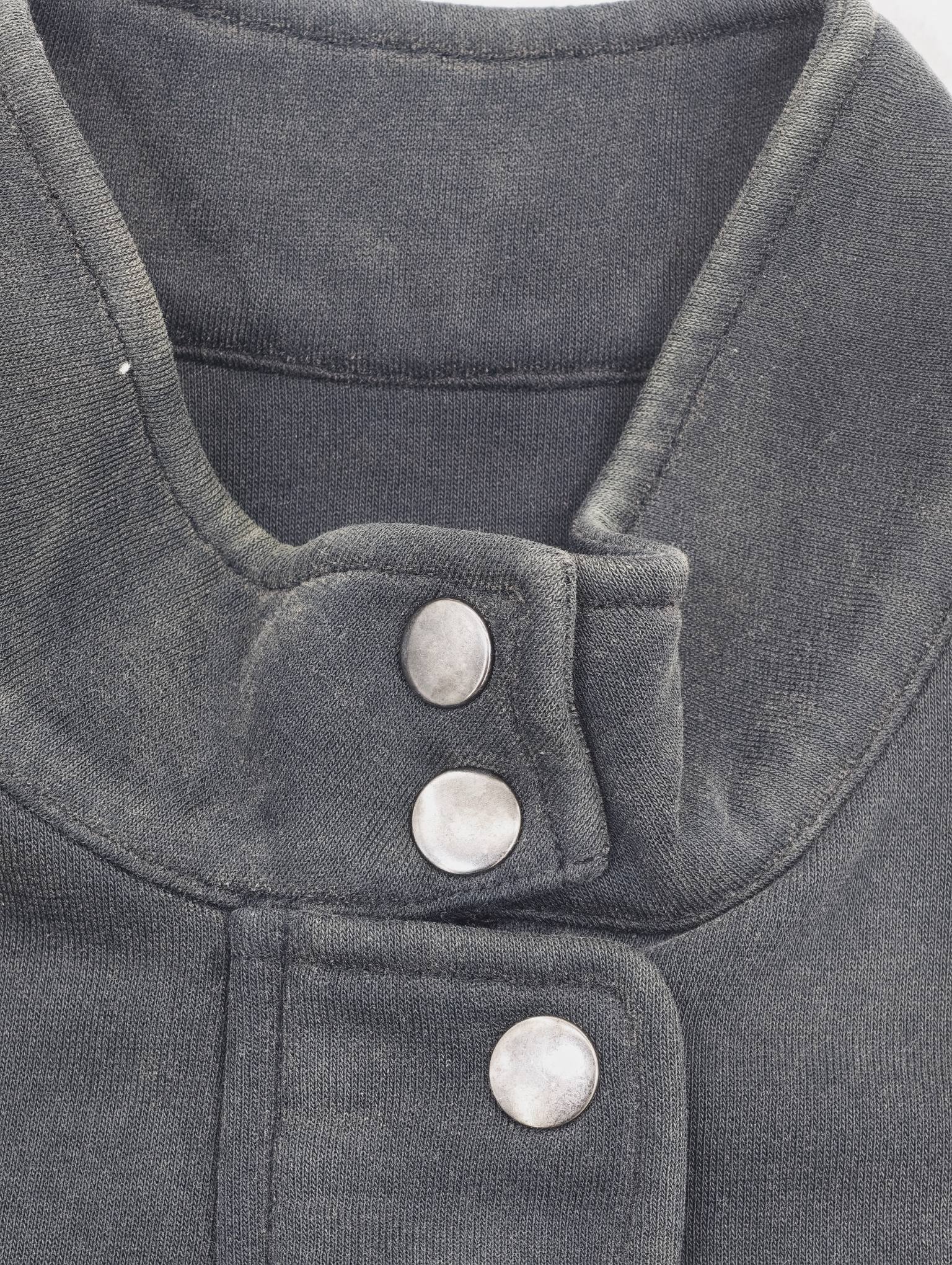 Close-up snap buttons and collar construction detail