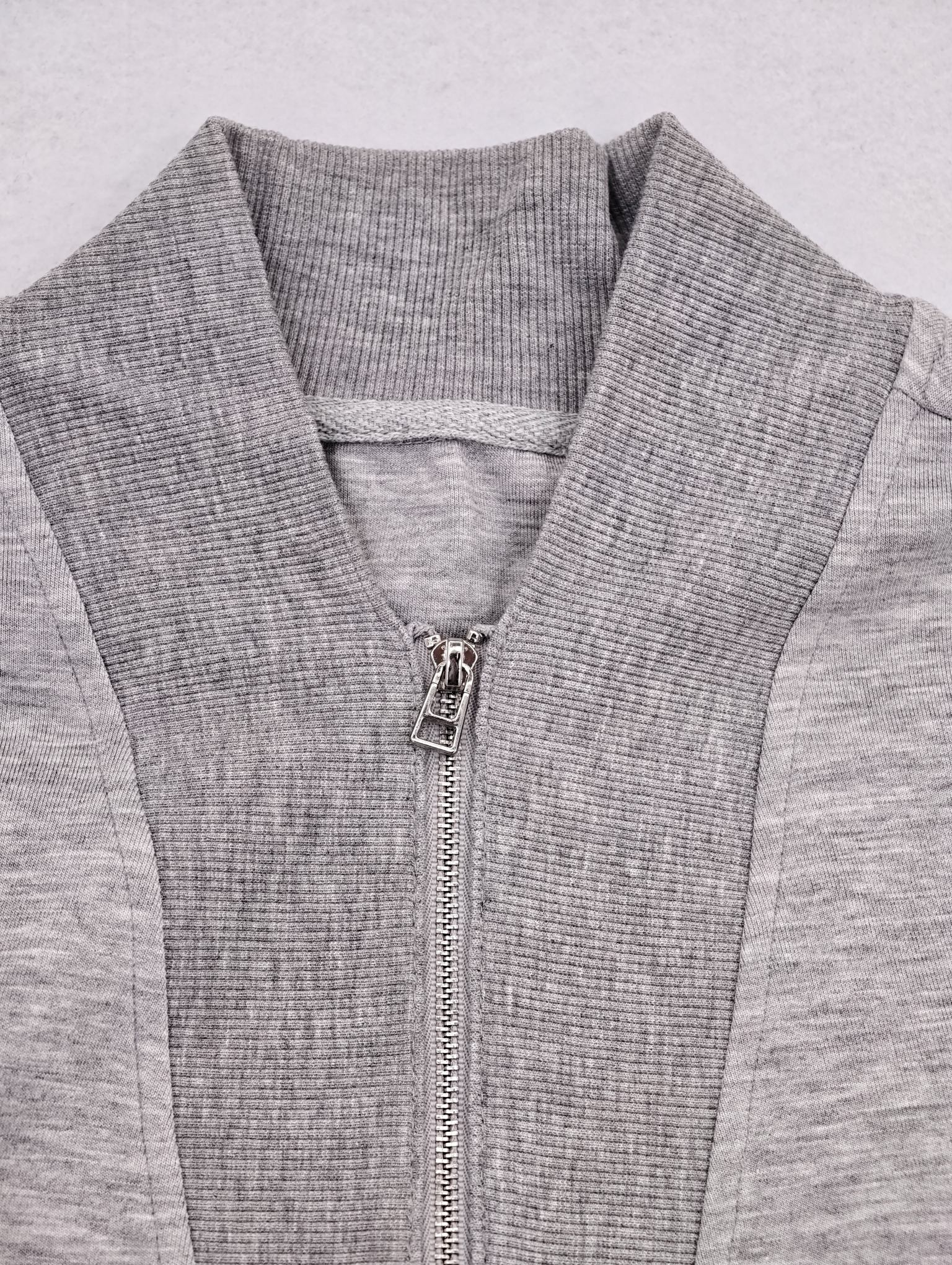 Ribbed stand collar and metal zipper detail