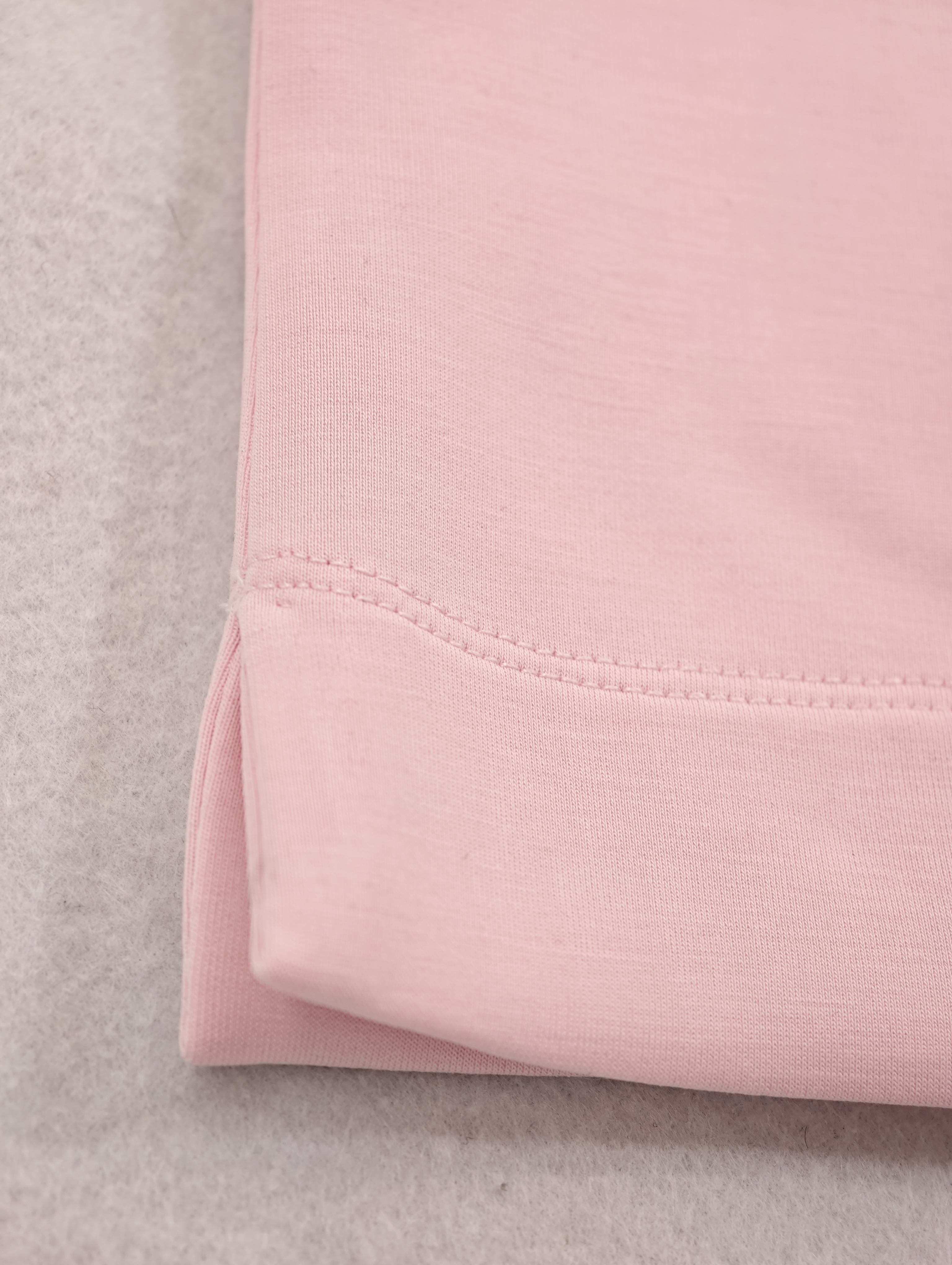 Blush pink short-sleeve hem with neat stitching