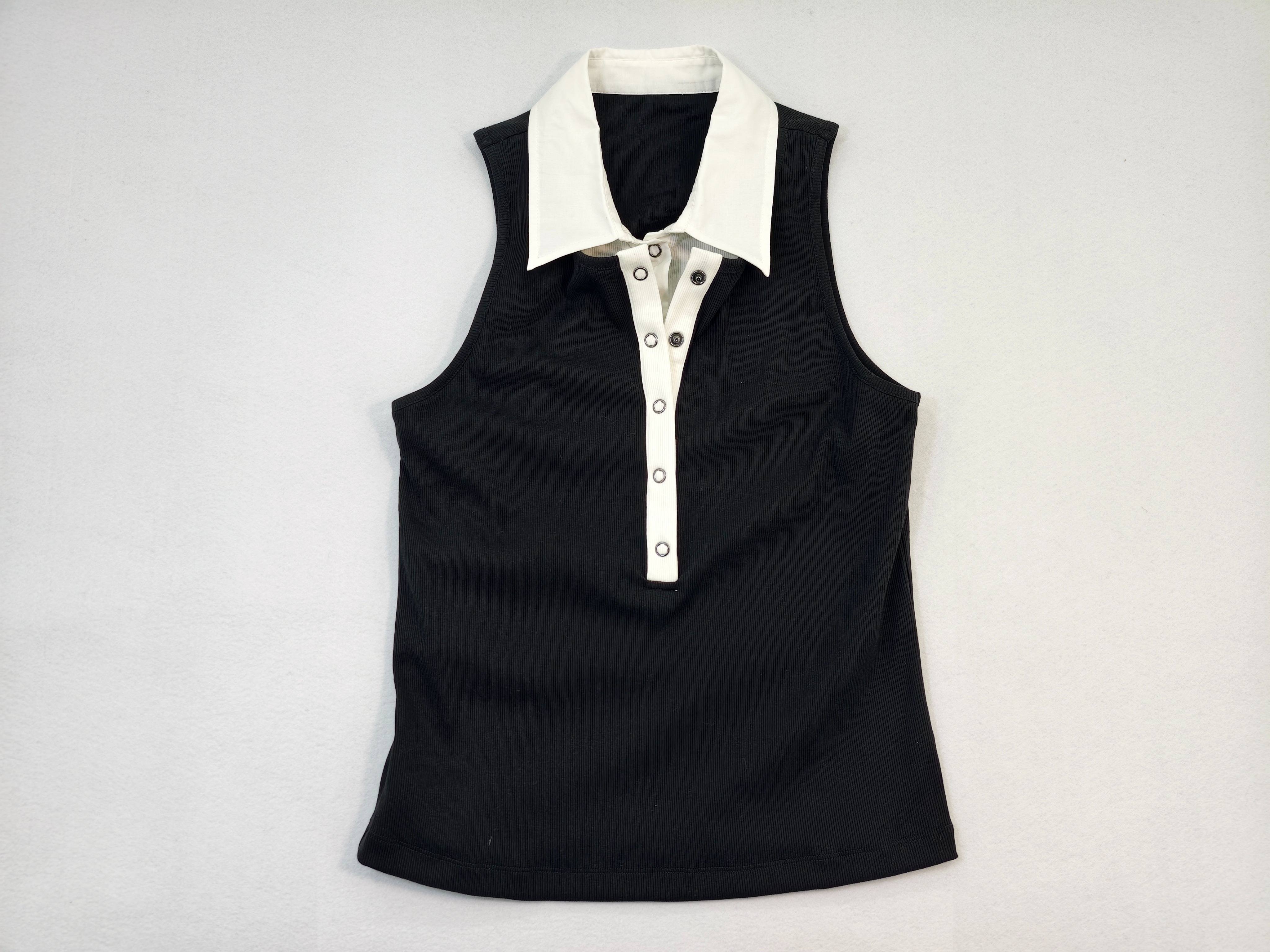 Black sleeveless polo top with white contrast collar