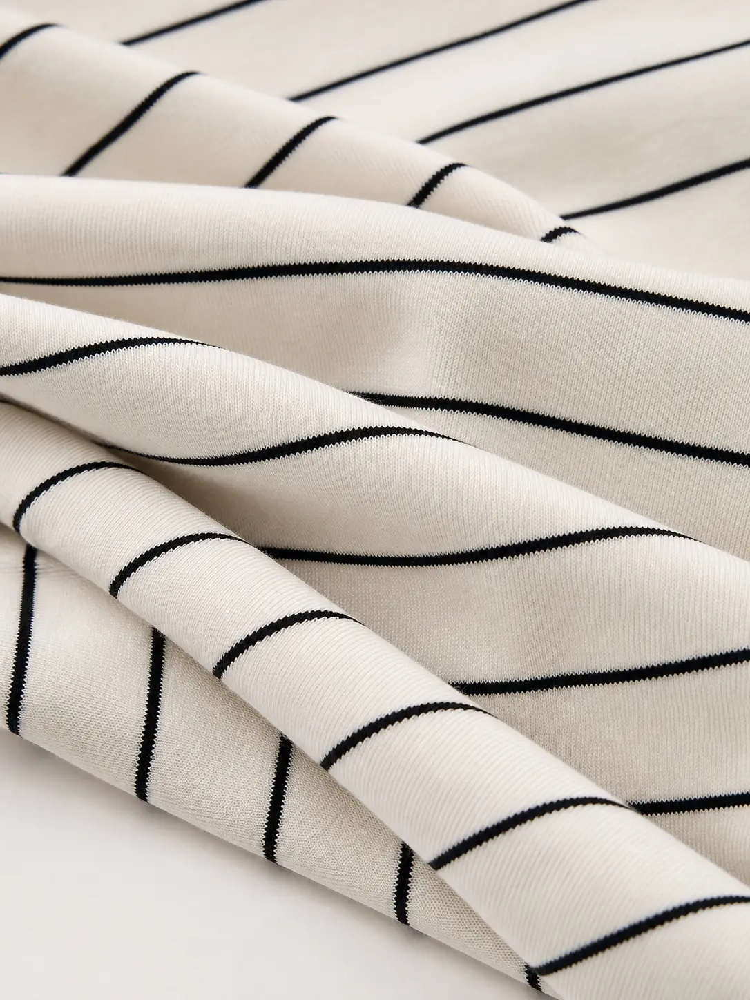 Cotton-modal striped interlock fabric drape detail