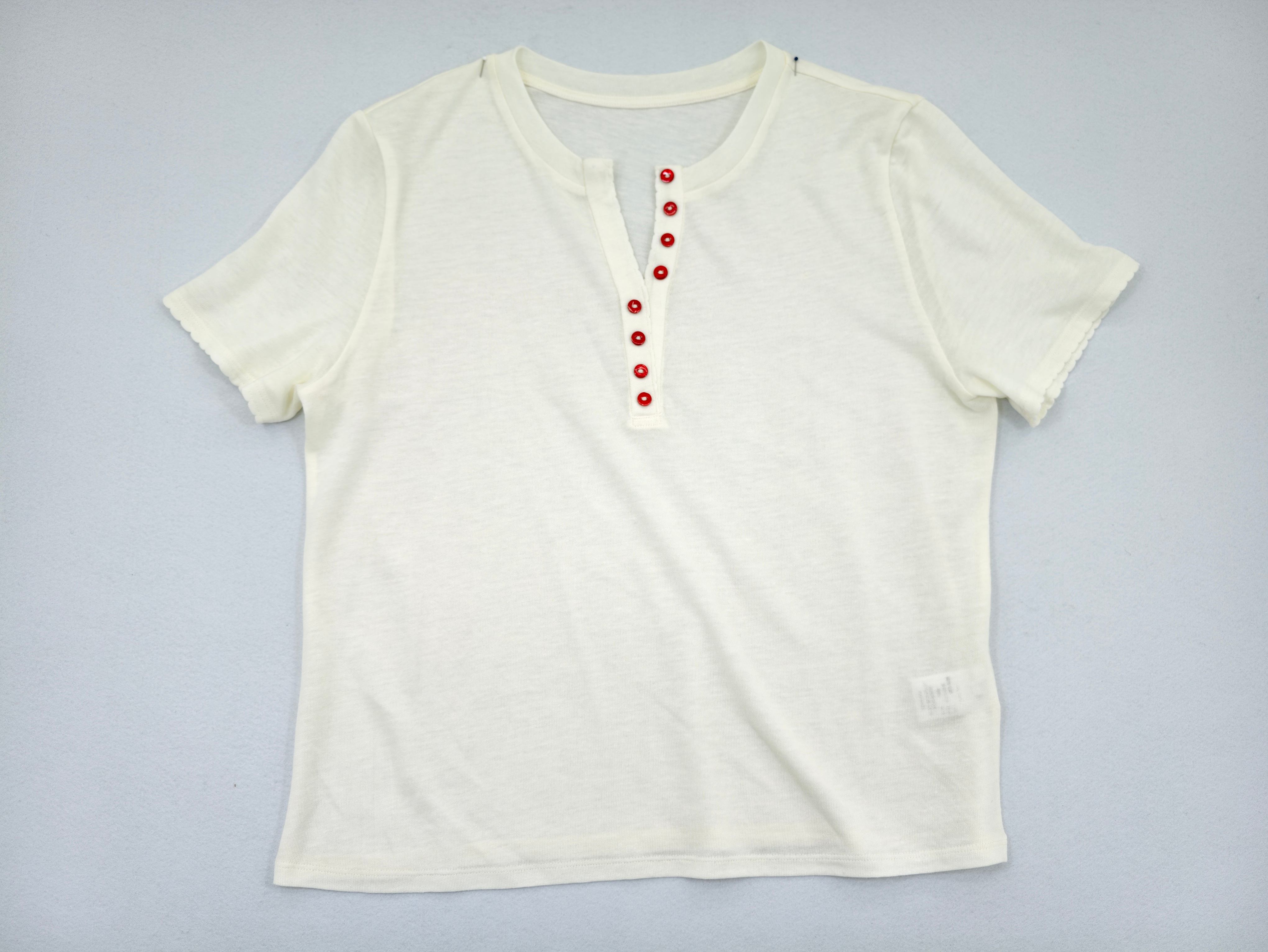 Women's short sleeve Henley knit top by custom apparel manufacturer