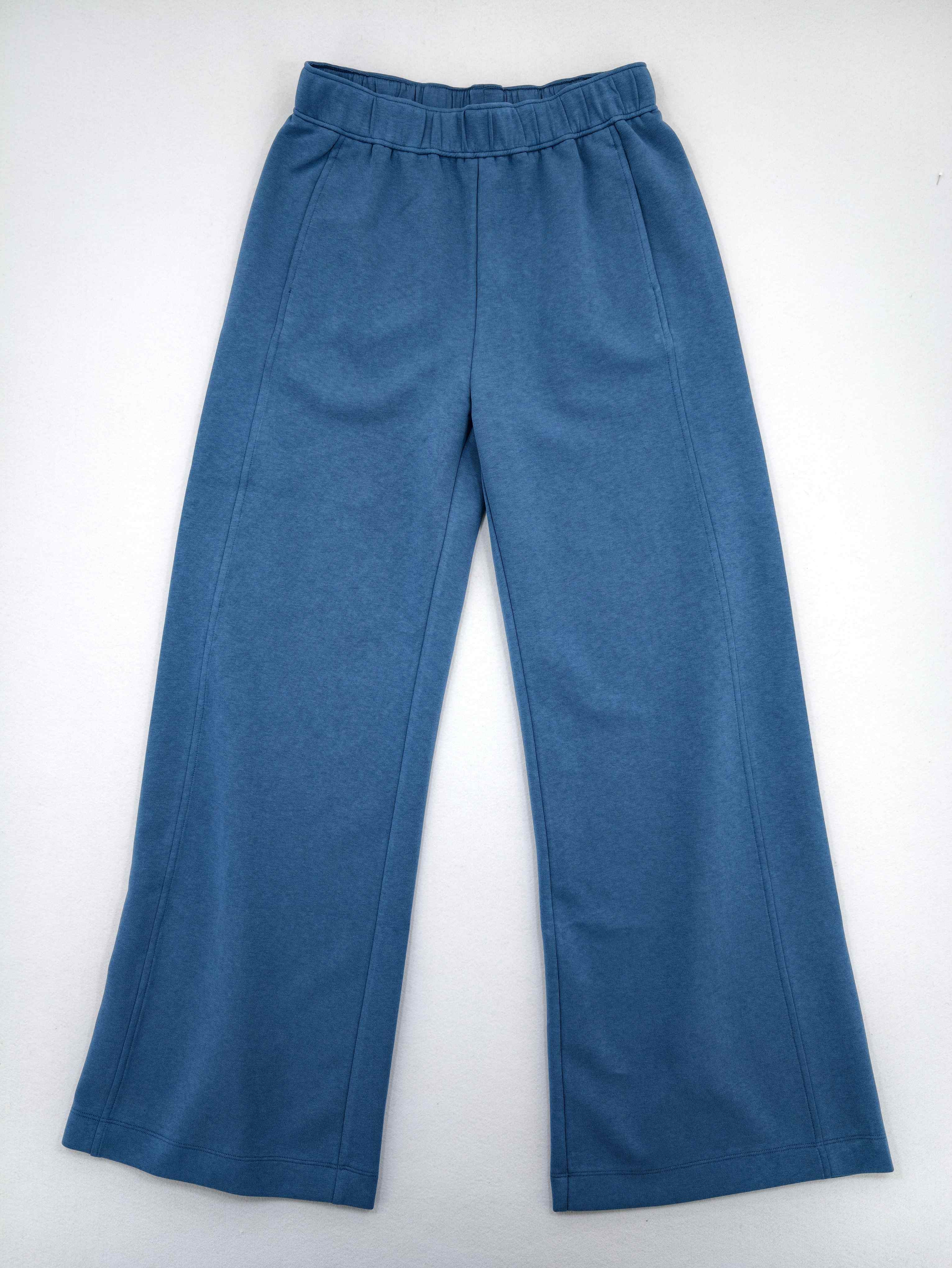 Front view of blue interlock lounge pants on model