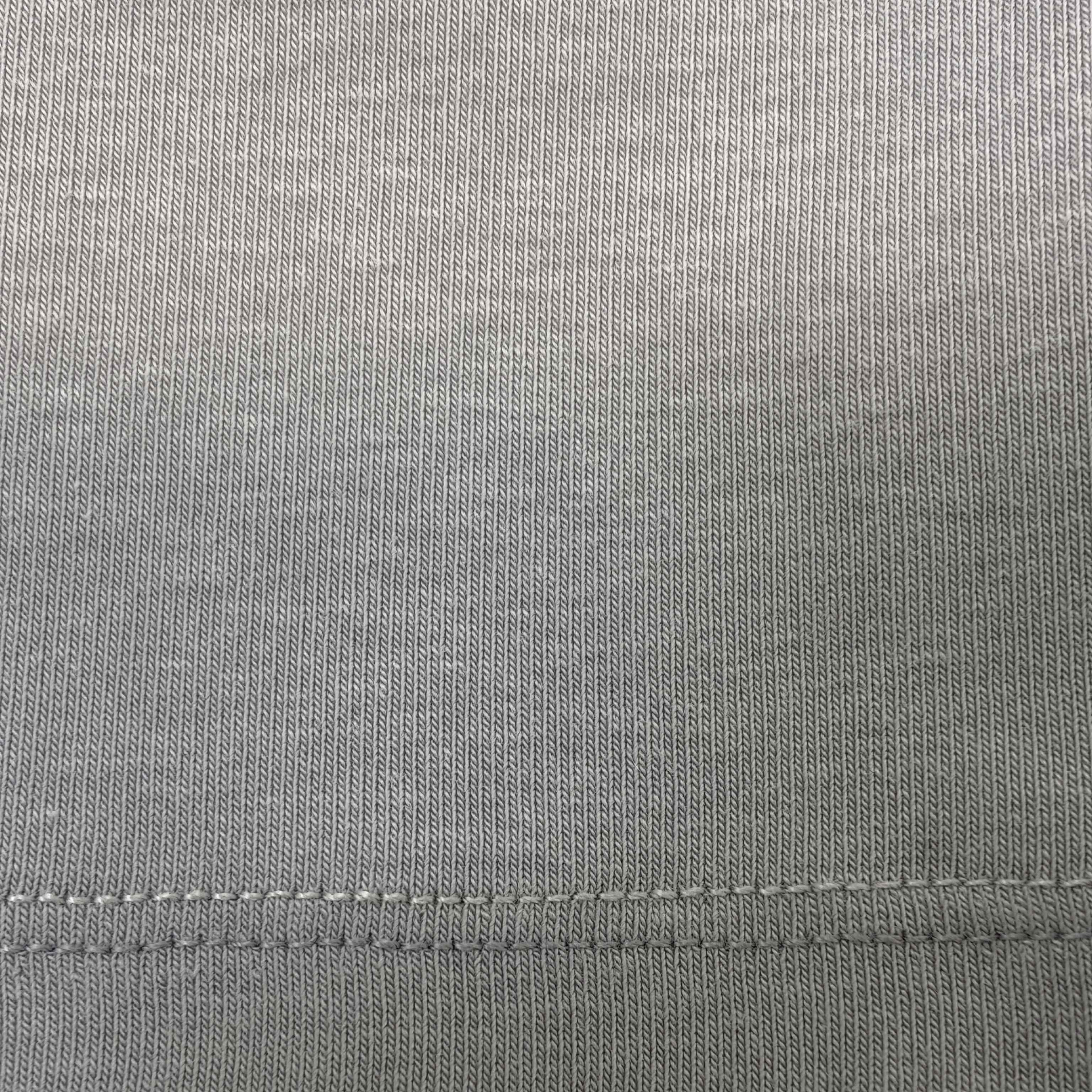 Stretch jersey texture with clean hem stitching detail