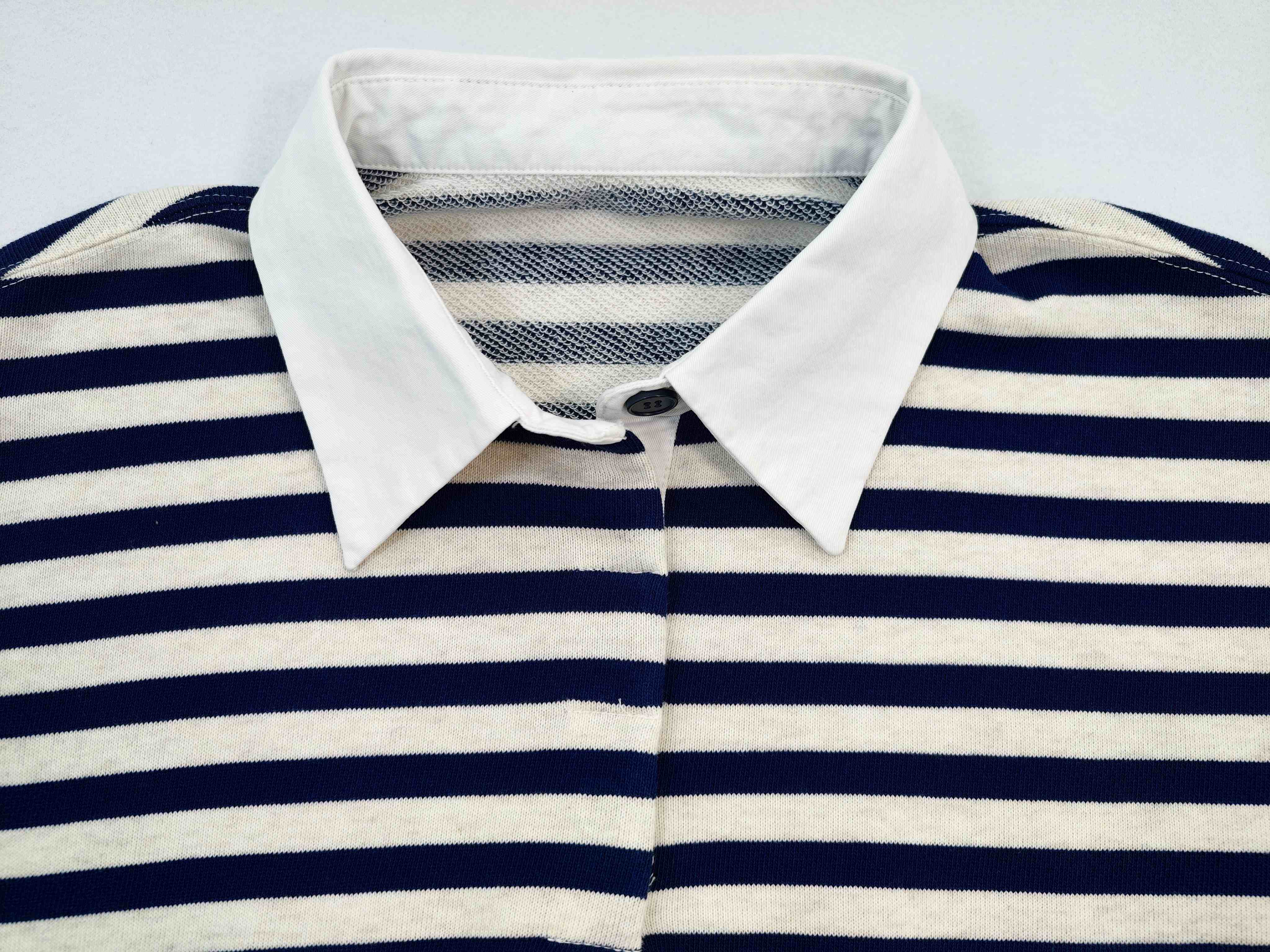 Contrast woven collar and button placket construction close-up