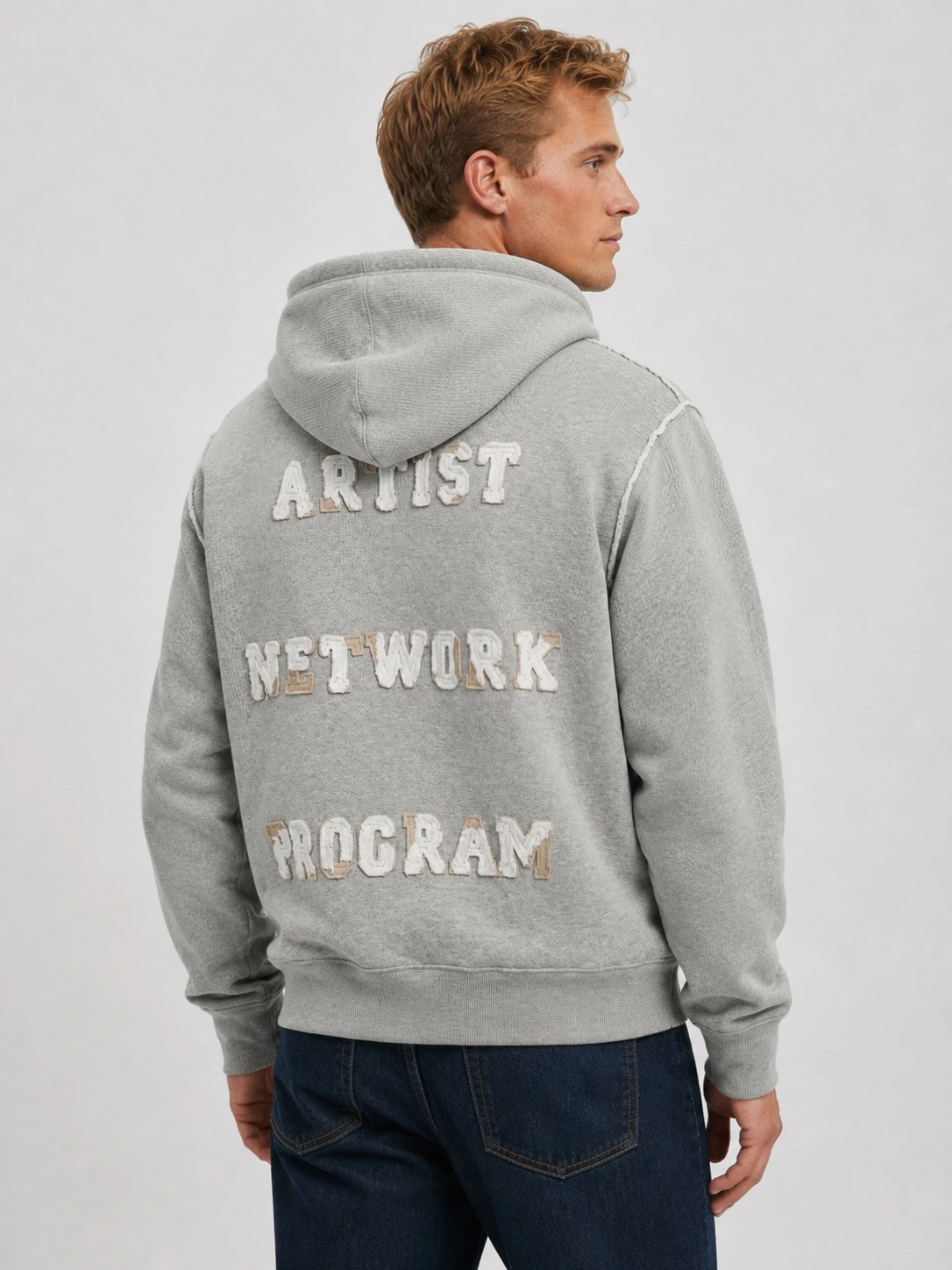 Back view with chenille slogan lettering detail