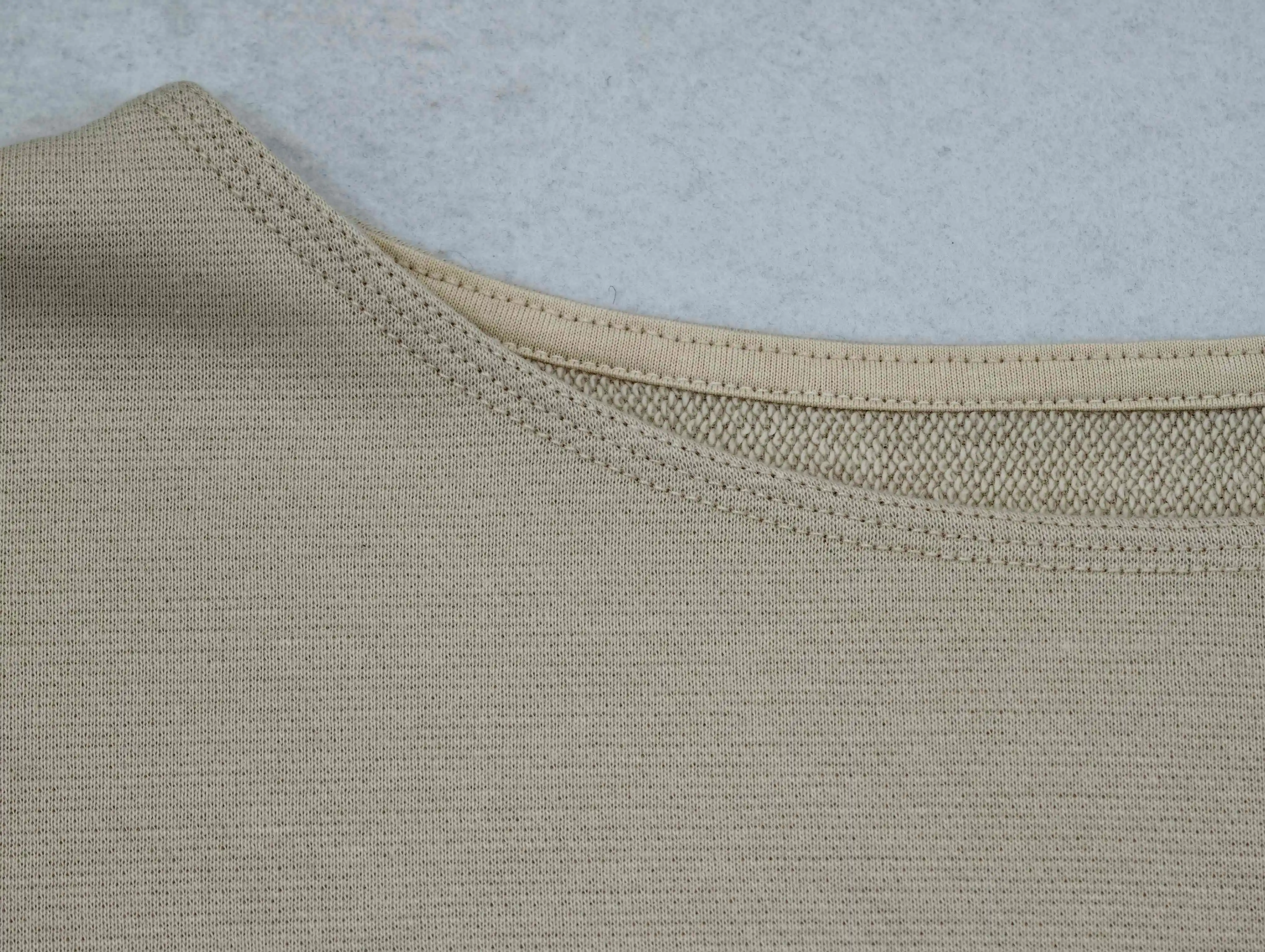 Custom bound neckline detail on cotton-rich French terry
