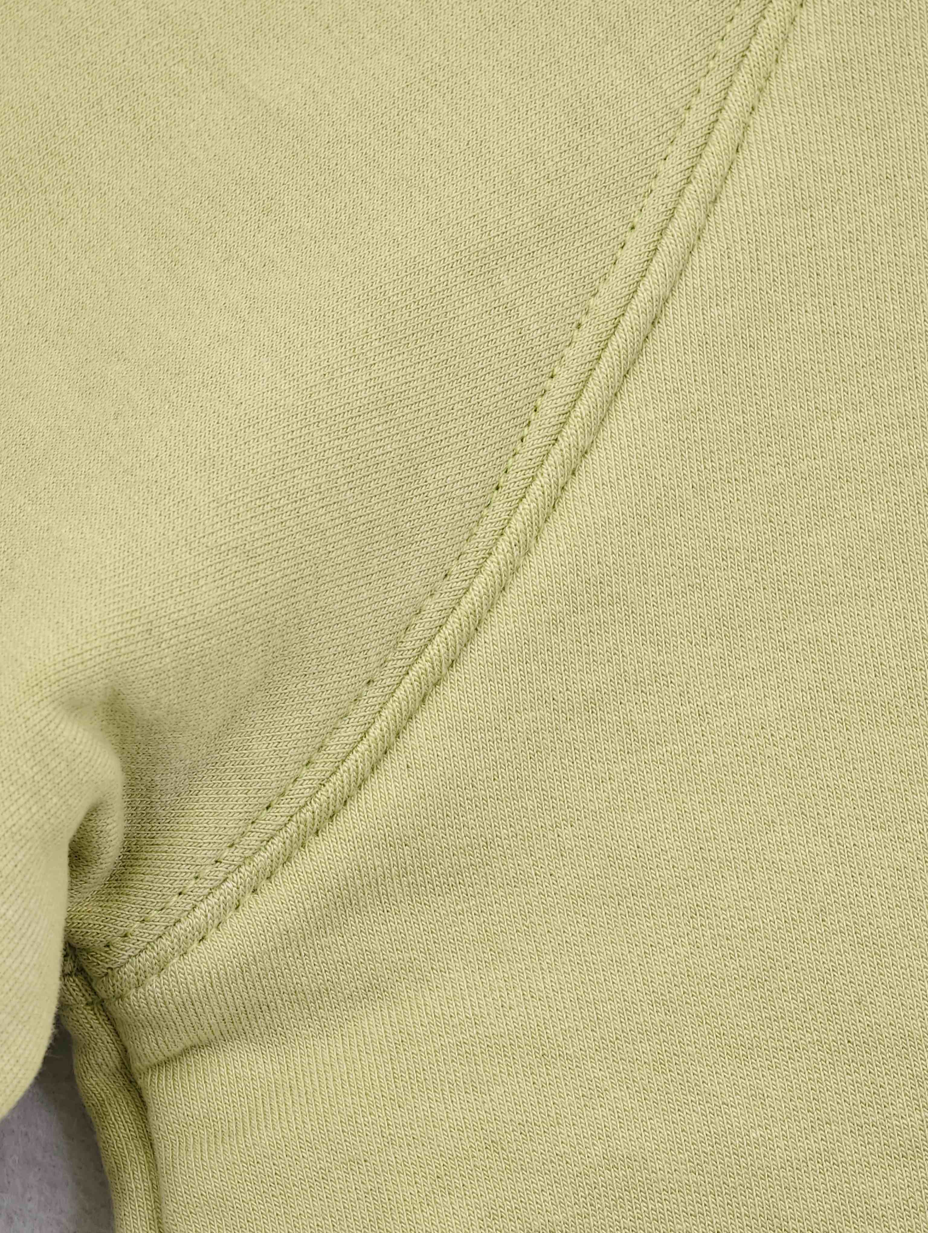 Close-up of raglan seam on modal-blend sweatshirt fabric