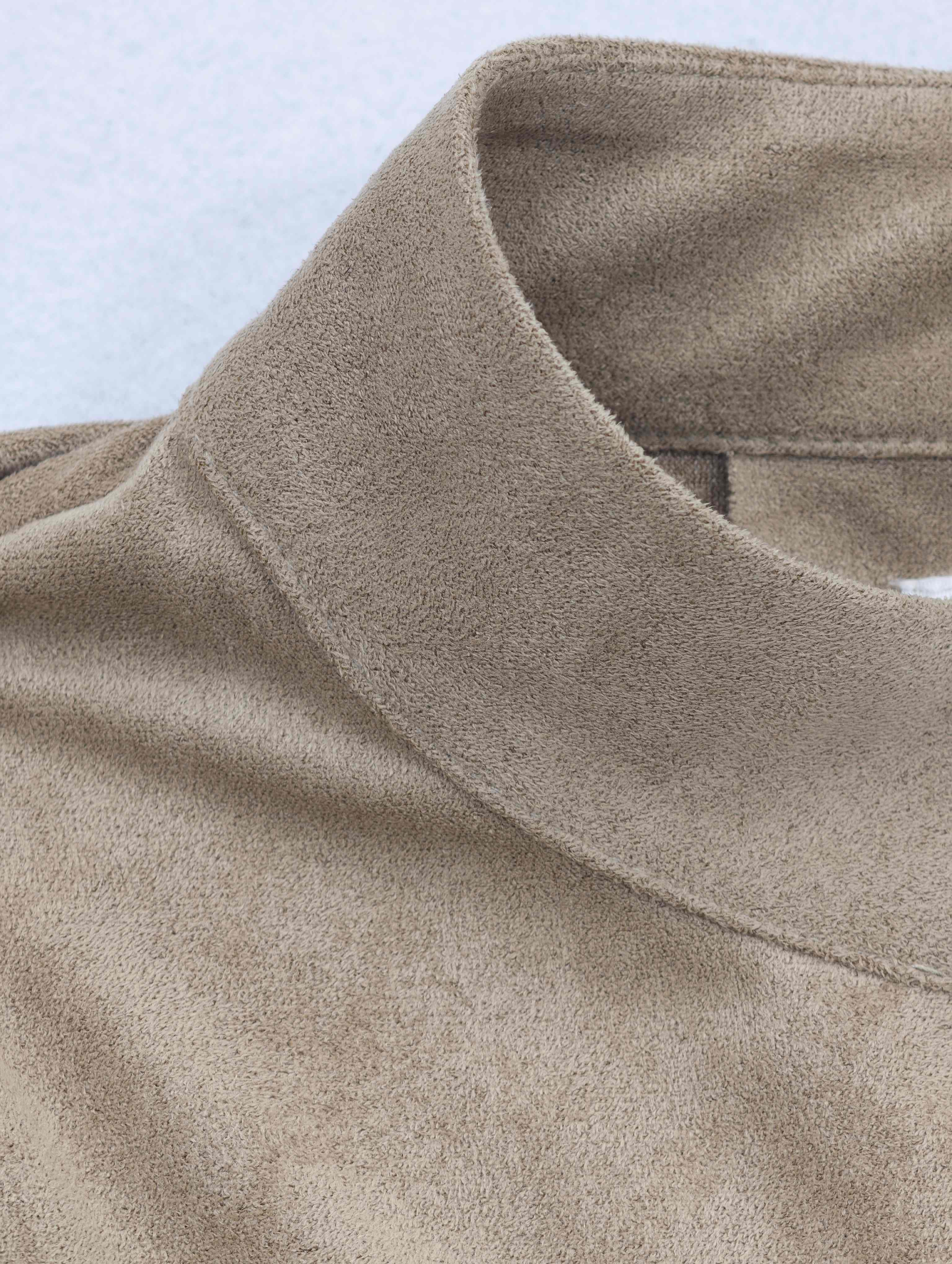 Scarf-style collar with clean edge stitching detail