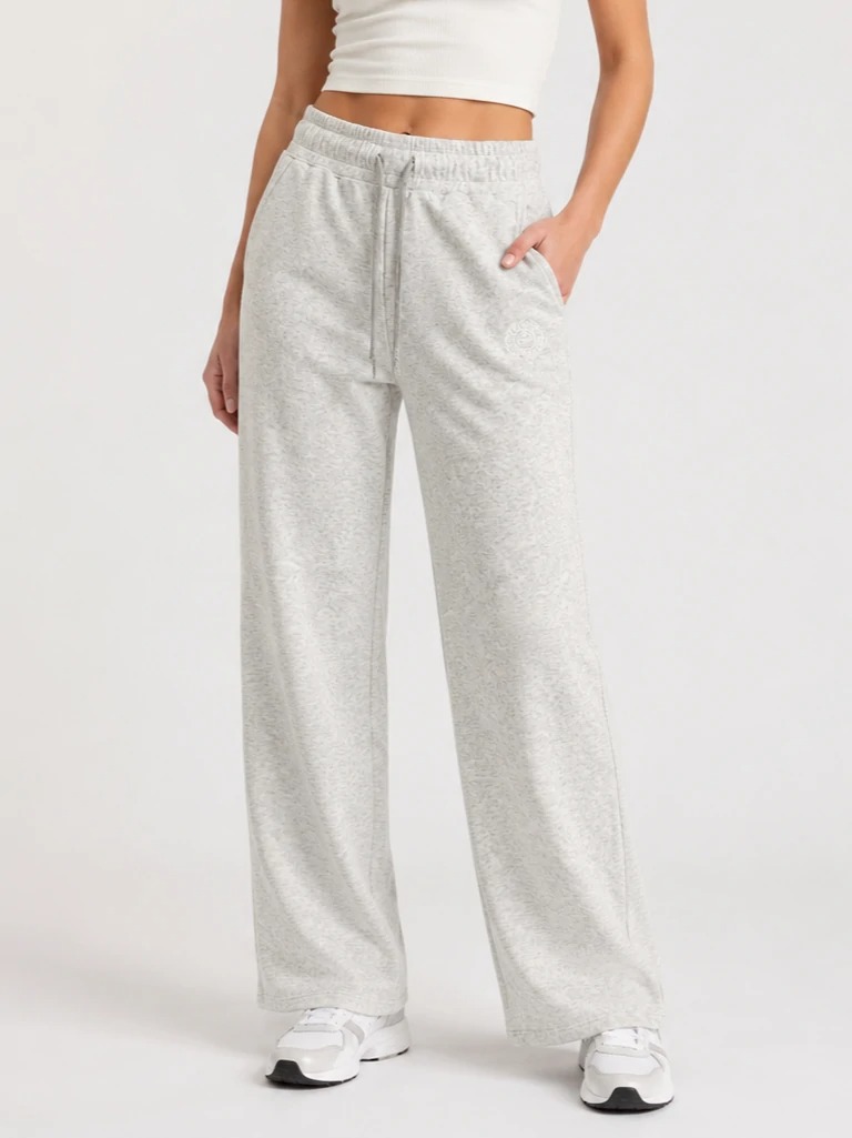 Model wearing light heather grey wide-leg knit pants