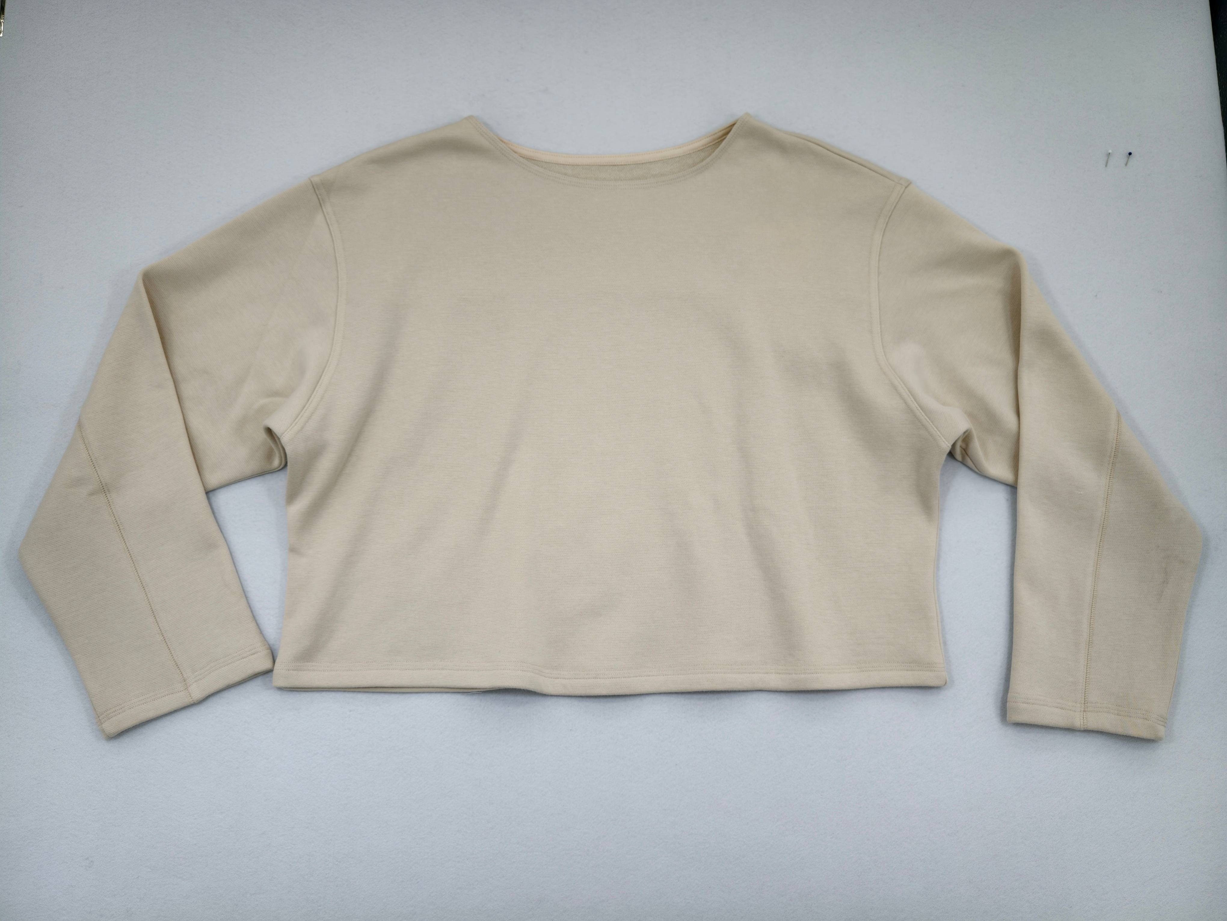Ivory cropped French terry pullover front flat view