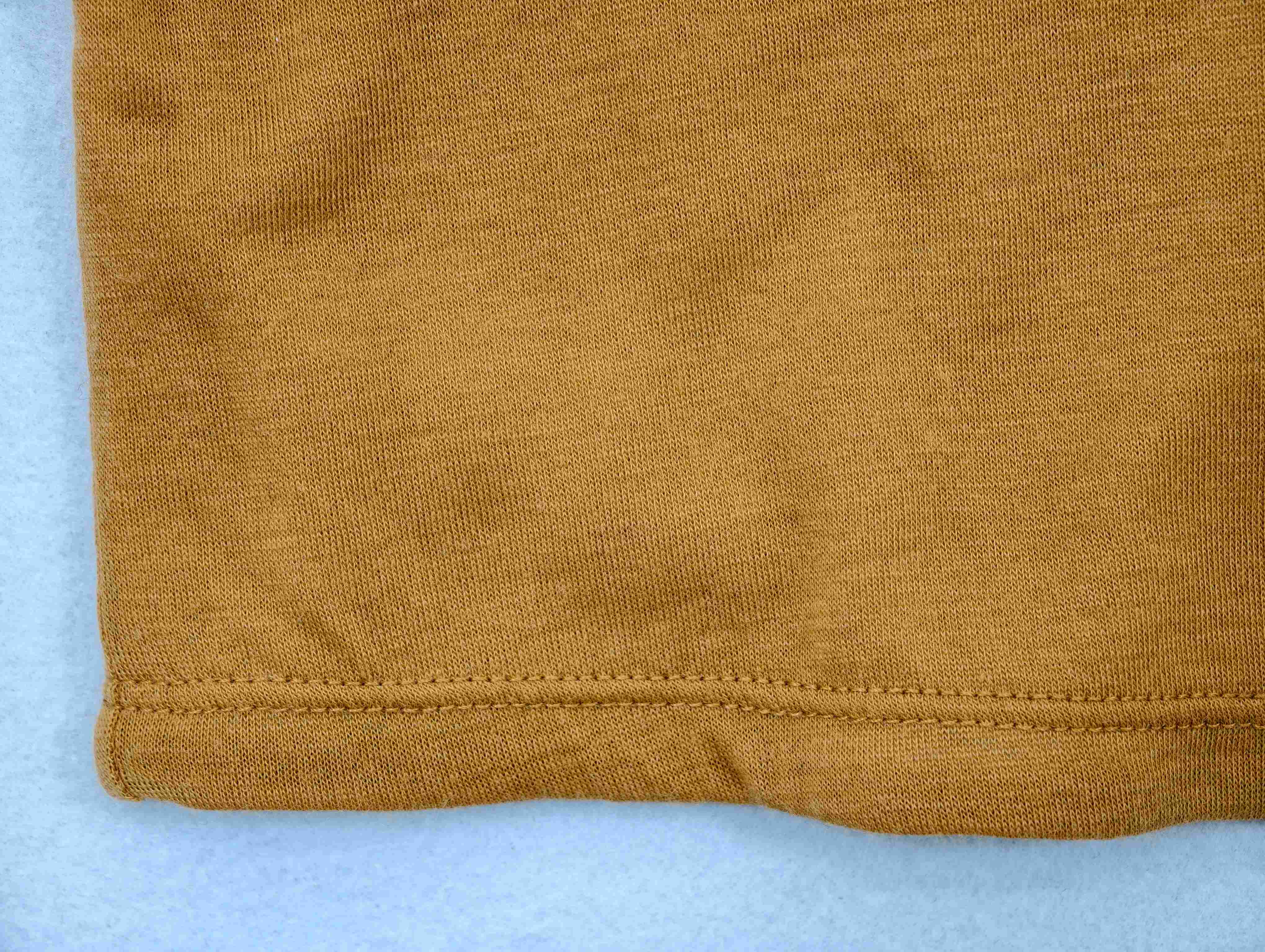 Ochre jersey texture with twin-needle hem stitching