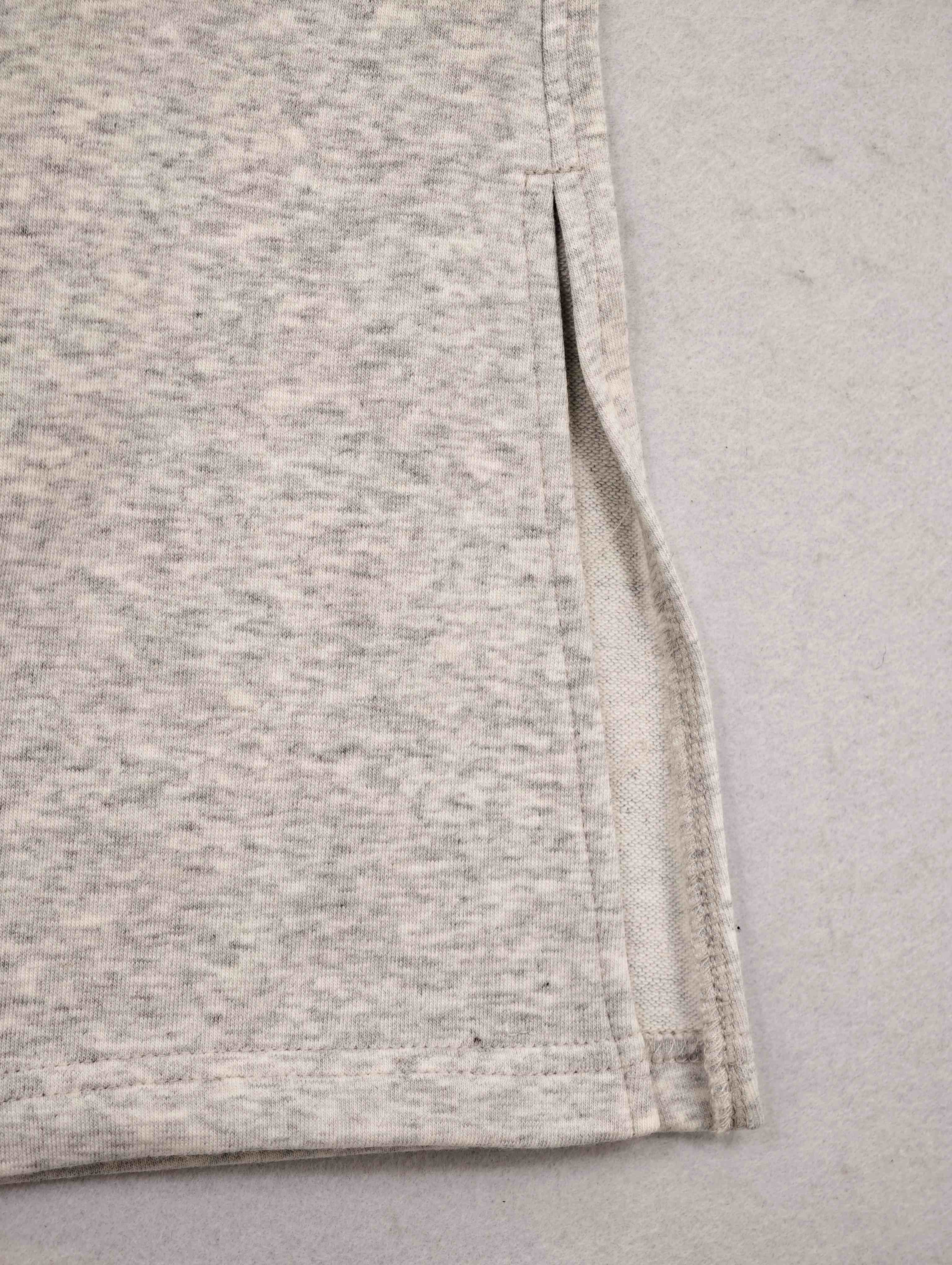 Side slit and clean hem stitching construction