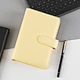 Planificateur à feuilles mobiles avec fermeture à pression