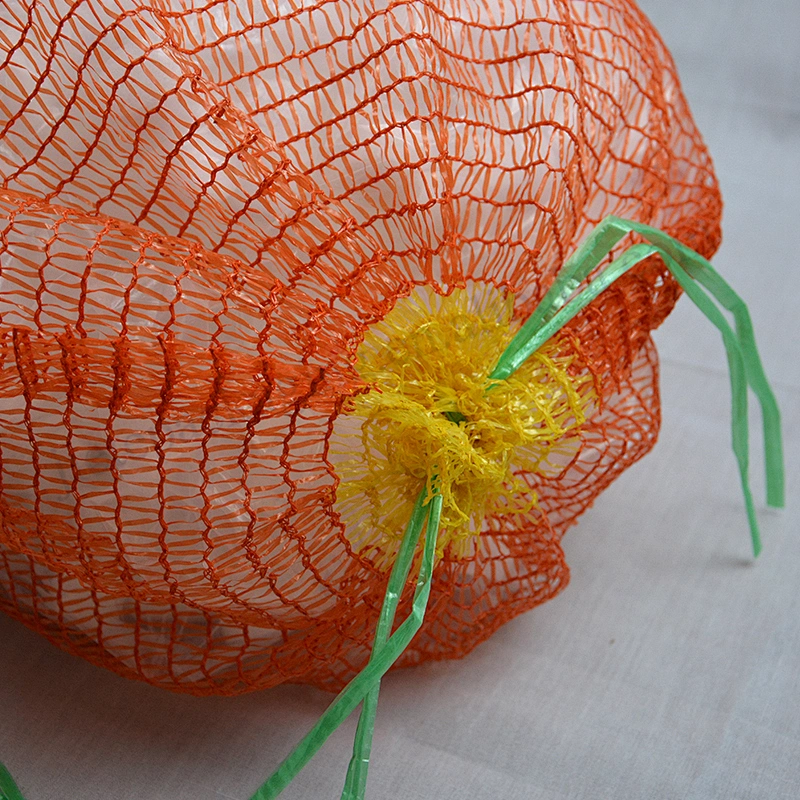 Drawstring orange raschel mesh bag for onions, potatoes, tomatoes, melons, oranges