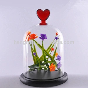 Artificial Flower in a Glass Dome on a Wooden Base
