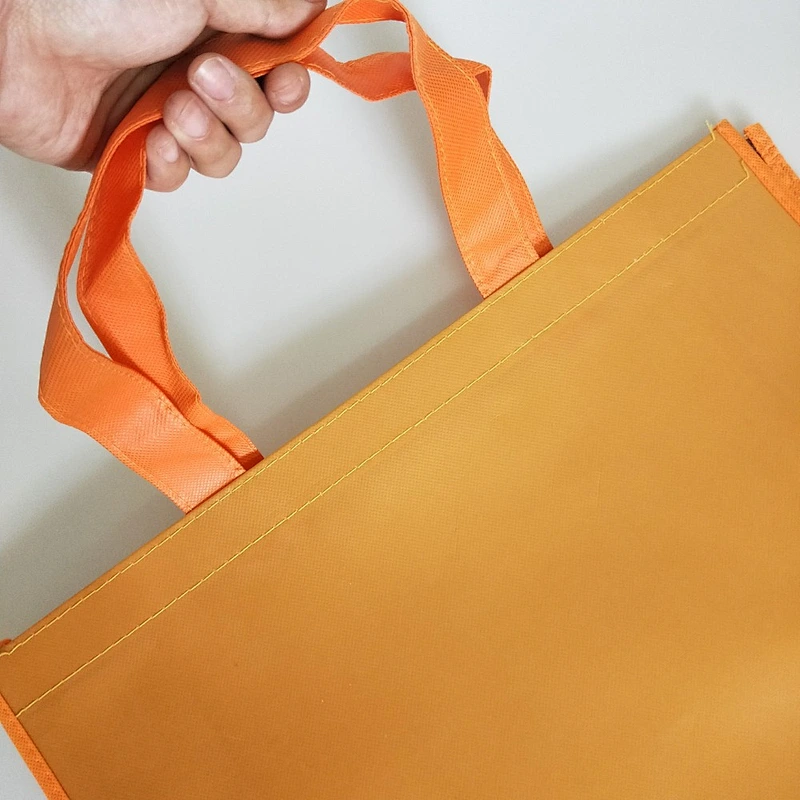 Custom wholesale orange non-woven bags for shopping