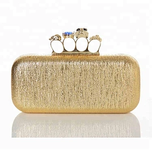 High quality Sleek and Chic women party evening bag gold straw clutch bag with four knuckles closure