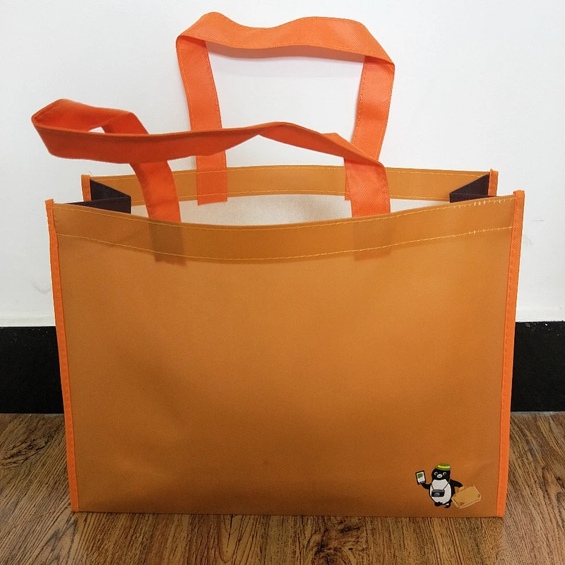 Custom wholesale orange non-woven bags for shopping