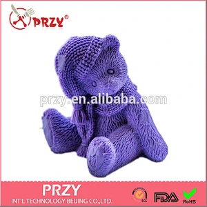 Handmade silicone Teddy in a knitted hat soap mold