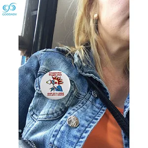 custom logo pin on metal badge with safety pins and buttons