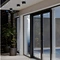 Black square surface mount outdoor LED downlights installed on a modern exterior ceiling above a sliding glass door and pool area.